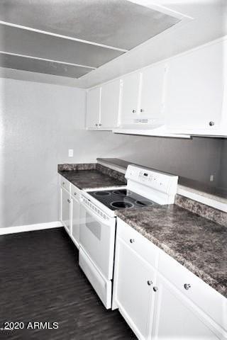 18202 North Cave Creek Road, Unit 231 Phoenix, AZ 85032 - Photo 5 of 18 a kitchen with a sink and cabinets