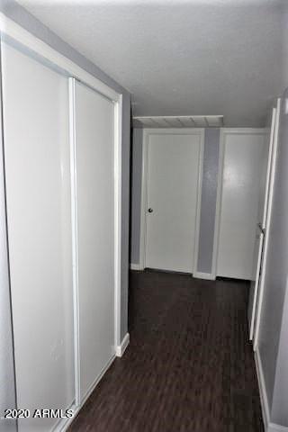 18202 North Cave Creek Road, Unit 231 Phoenix, AZ 85032 - Photo 7 of 18 a view of an empty room with wooden floor