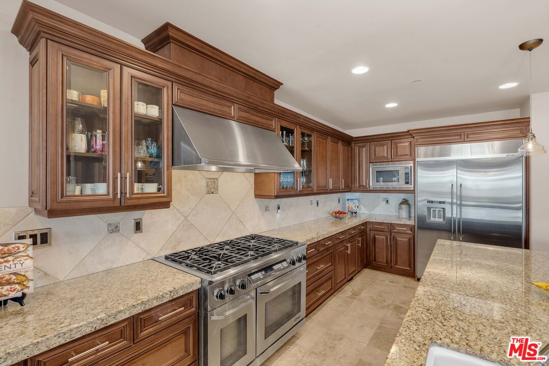 1990 Highway 46 Shandon, CA 93461 - Photo 12 of 57 a kitchen with stainless steel appliances granite countertop a stove a sink and a refrigerator
