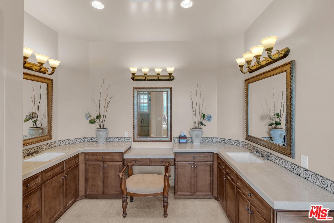 1990 Highway 46 Shandon, CA 93461 - Photo 21 of 57 a bathroom with a granite countertop sink a toilet a mirror and shower