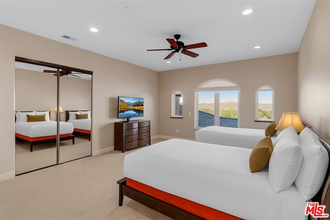 1990 Highway 46 Shandon, CA 93461 - Photo 32 of 57 a bedroom with a bed and a chandelier