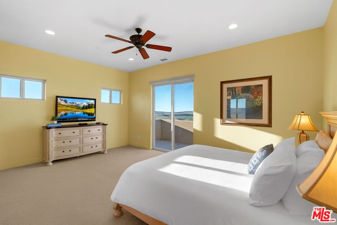 1990 Highway 46 Shandon, CA 93461 - Photo 34 of 57 a bedroom with a bed and a flat screen tv