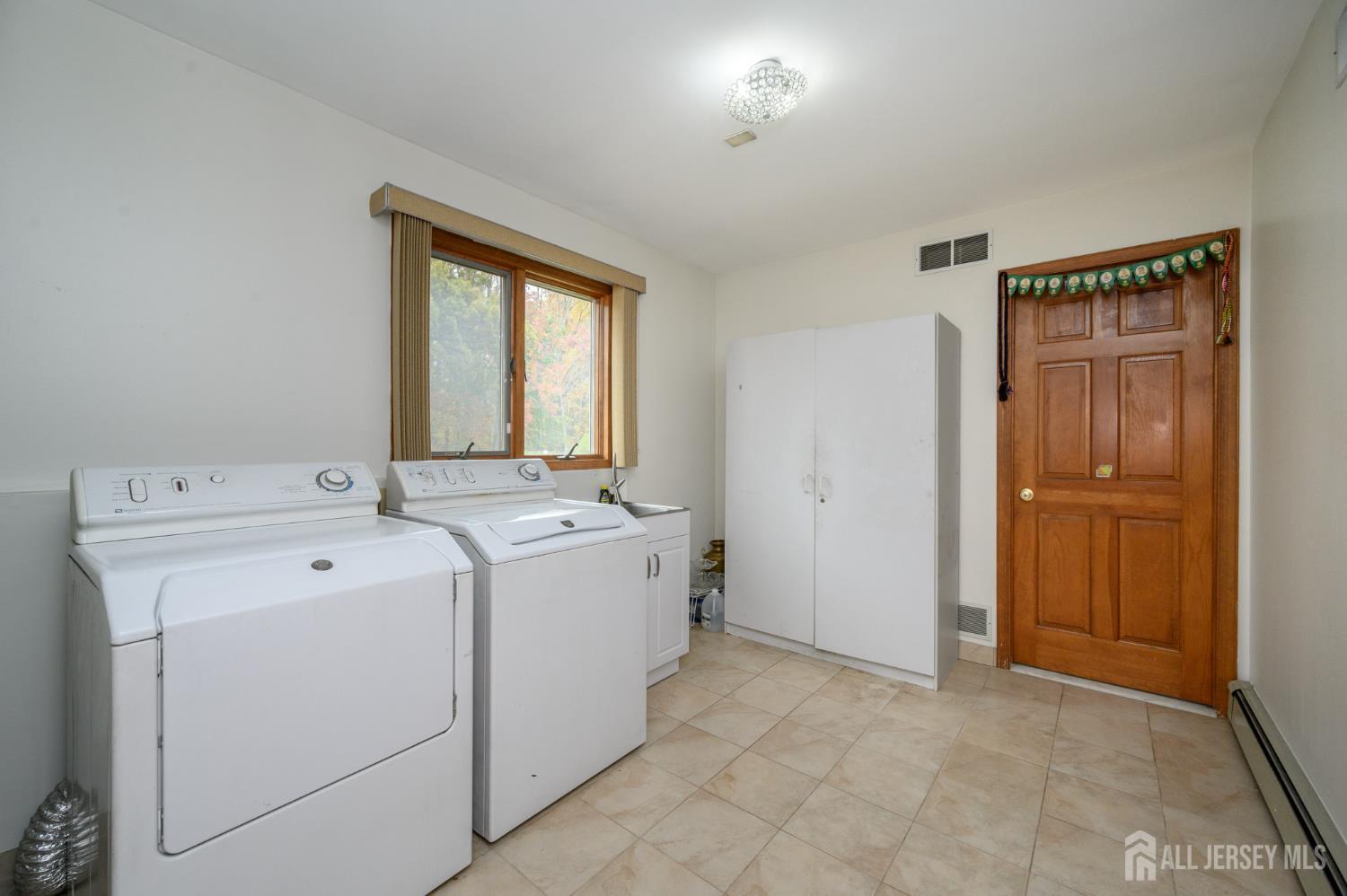 4 Drinking Brook Road Monmouth Junction, NJ 08852 - Photo 28 of 74 a view of utility room with washer and dryer