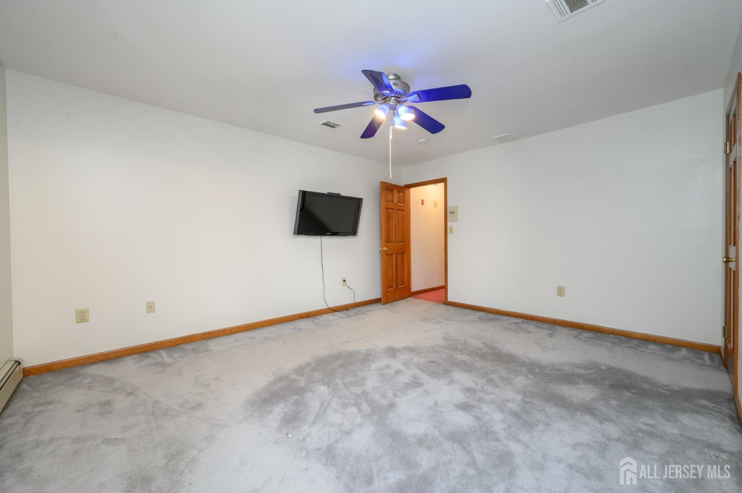 4 Drinking Brook Road Monmouth Junction, NJ 08852 - Photo 36 of 74 a view of an empty room with a ceiling fan and window