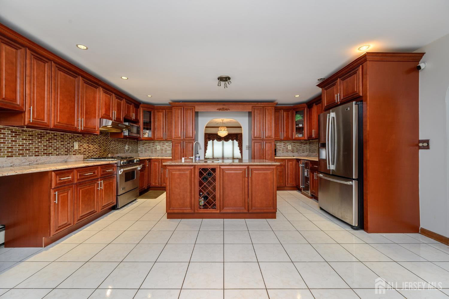 4 Drinking Brook Road Monmouth Junction, NJ 08852 - Photo 7 of 74 a kitchen with stainless steel appliances granite countertop a refrigerator oven a sink with granite countertops and cabinets