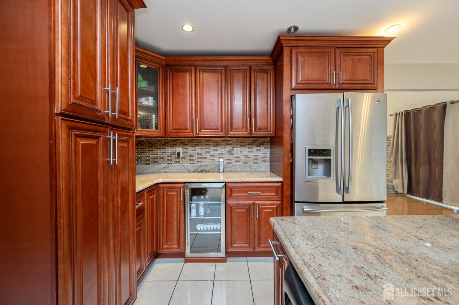 4 Drinking Brook Road Monmouth Junction, NJ 08852 - Photo 10 of 74 a kitchen with stainless steel appliances granite countertop a refrigerator and a sink