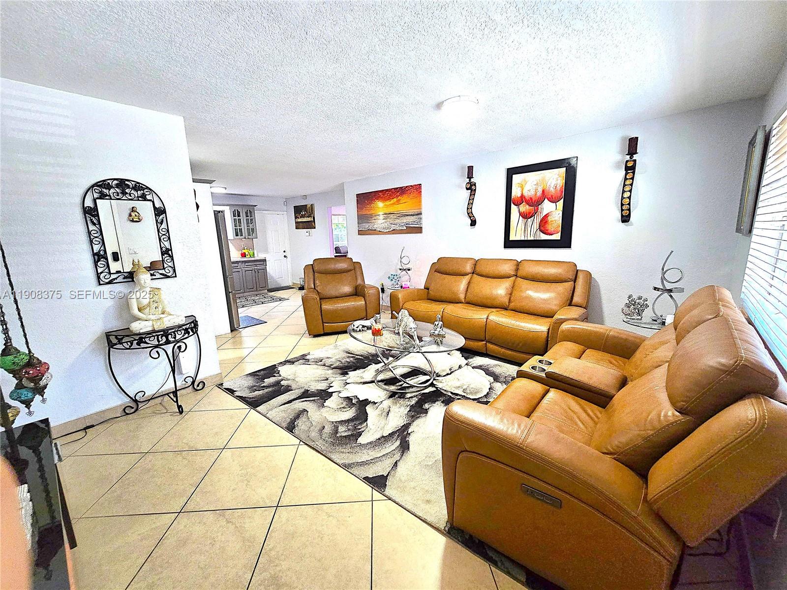 11152 Southwest 7th Street Sweetwater, FL 33174 - Photo 12 of 53 a living room with furniture and a window