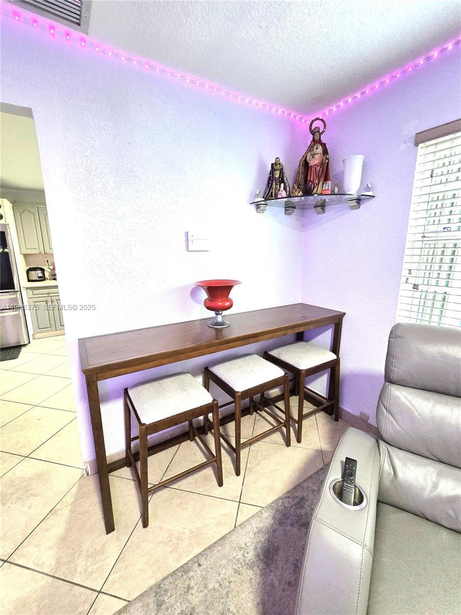 11152 Southwest 7th Street Sweetwater, FL 33174 - Photo 16 of 53 a work room with furniture and wooden floor