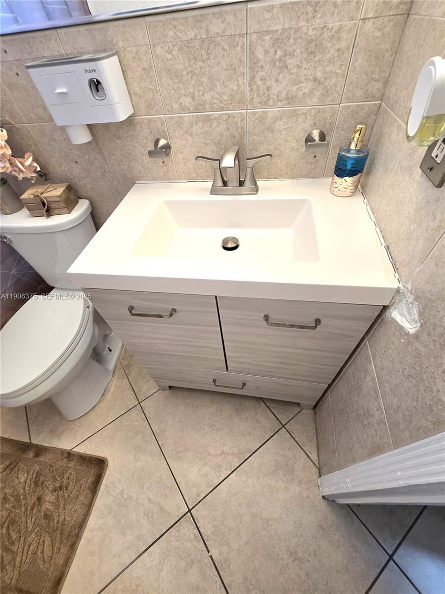 11152 Southwest 7th Street Sweetwater, FL 33174 - Photo 28 of 53 a bathroom with a sink and a toilet