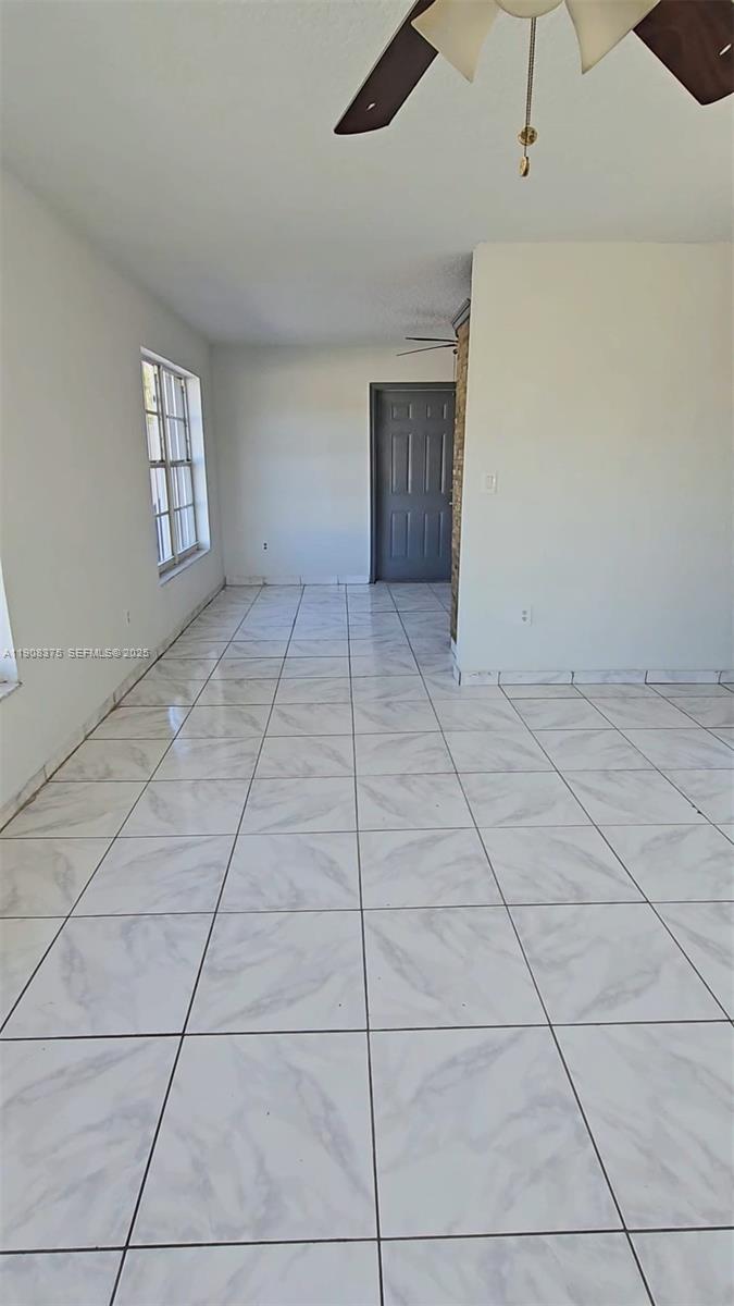 11152 Southwest 7th Street Sweetwater, FL 33174 - Photo 42 of 53 a view of an empty room with a window