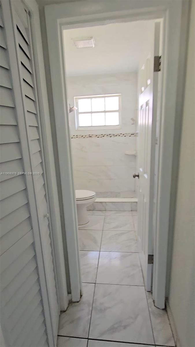 11152 Southwest 7th Street Sweetwater, FL 33174 - Photo 48 of 53 a view of a hallway to rooms and stairs