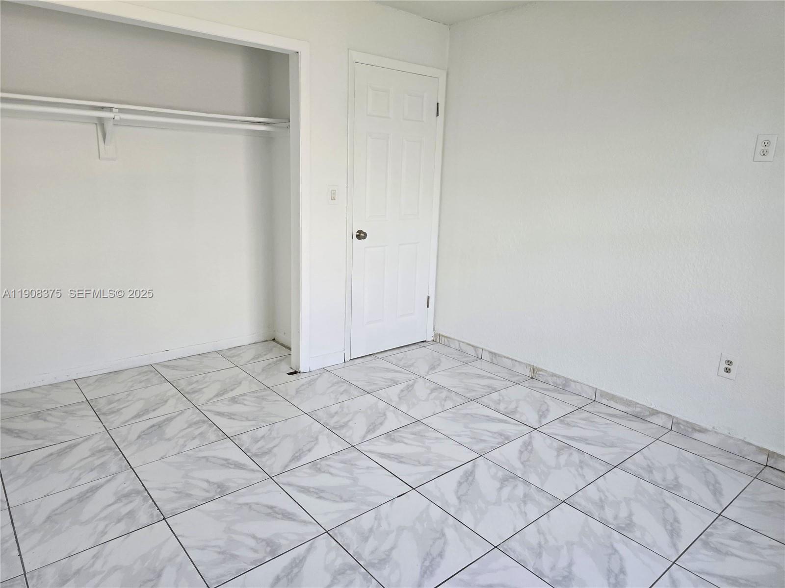 11152 Southwest 7th Street Sweetwater, FL 33174 - Photo 50 of 53 a view of a room with racks on the wall