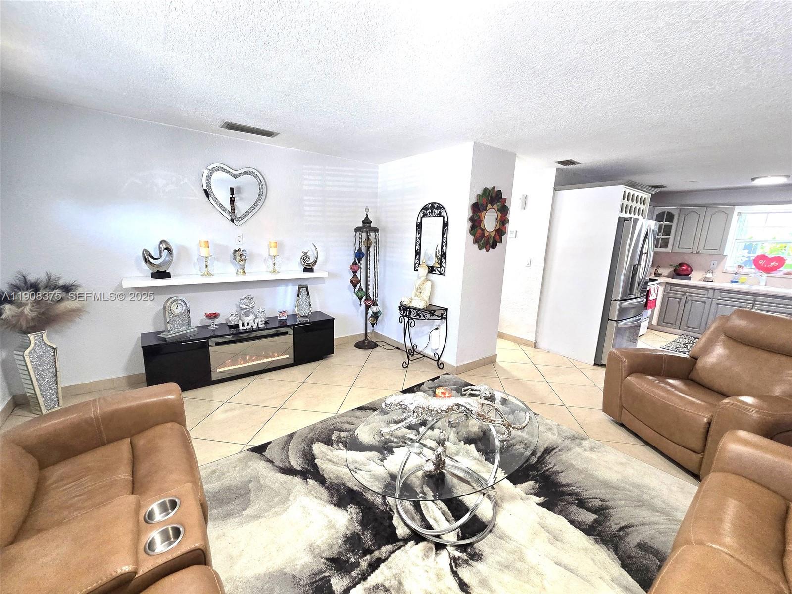11152 Southwest 7th Street Sweetwater, FL 33174 - Photo 9 of 53 a living room with furniture and a couch