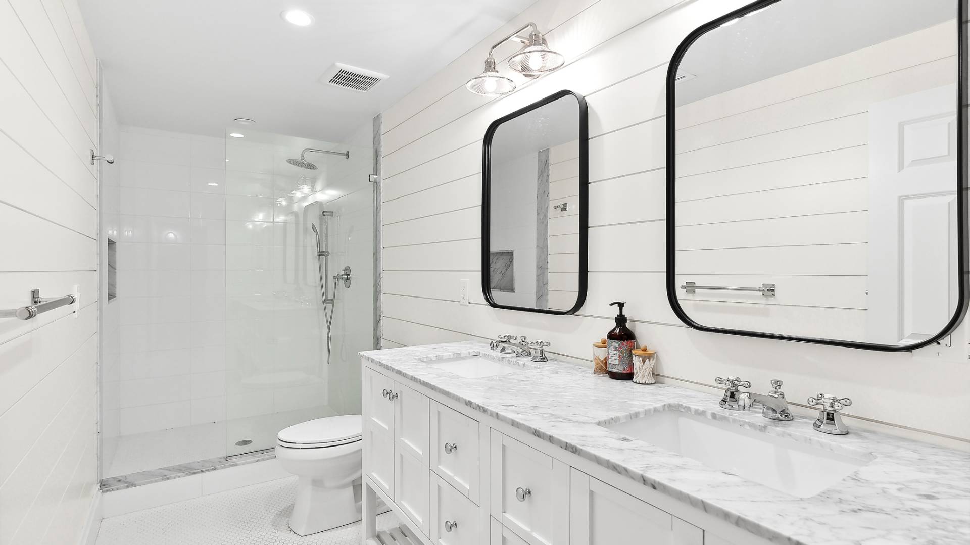 4 Arthur Avenue Bridgehampton, NY 11932 - Photo 11 of 13 a bathroom with a granite countertop sink a toilet and a mirror