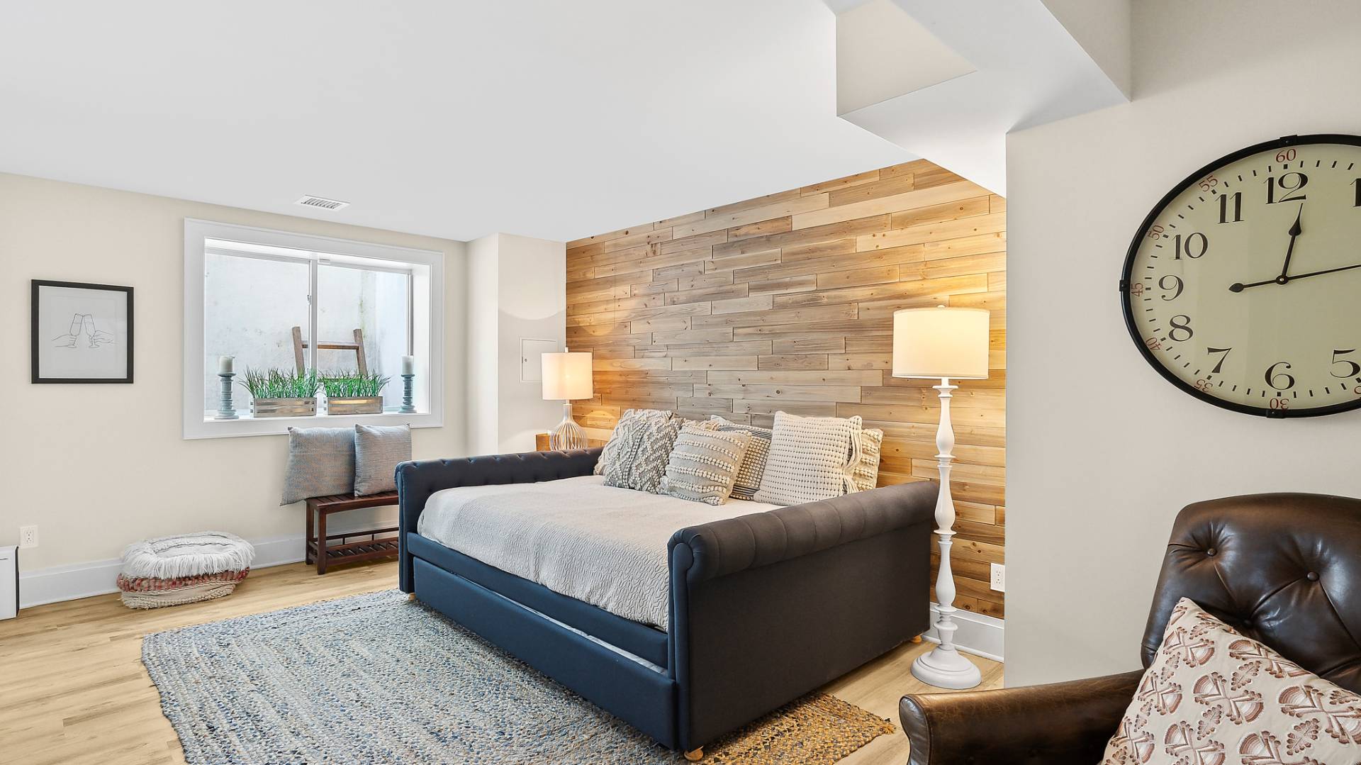 4 Arthur Avenue Bridgehampton, NY 11932 - Photo 12 of 13 a bed room with a bed a couch and a window