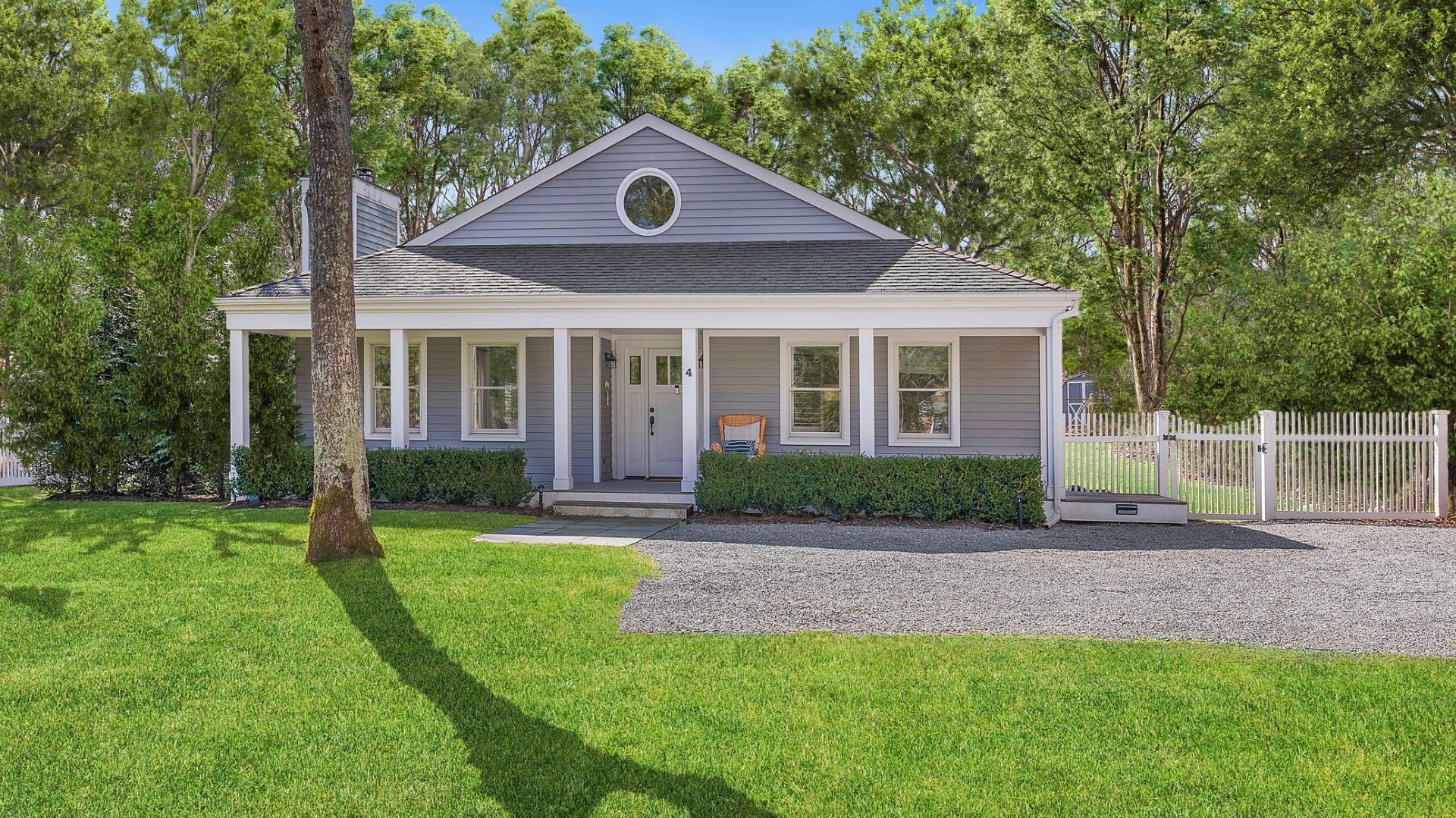 4 Arthur Avenue Bridgehampton, NY 11932 - Photo 2 of 13 a front view of a house with a yard and garage