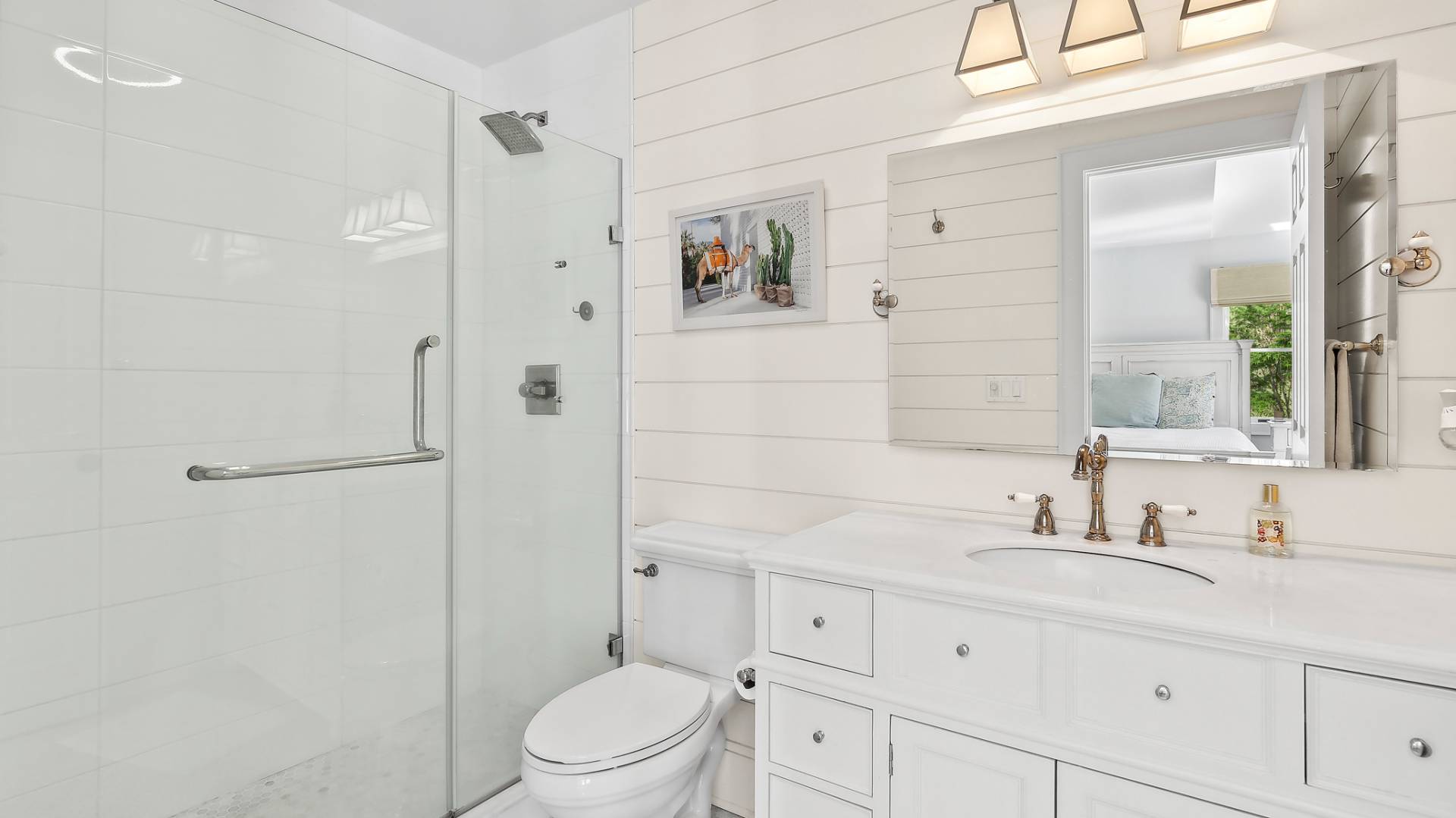 4 Arthur Avenue Bridgehampton, NY 11932 - Photo 7 of 13 a bathroom with a sink a toilet and shower
