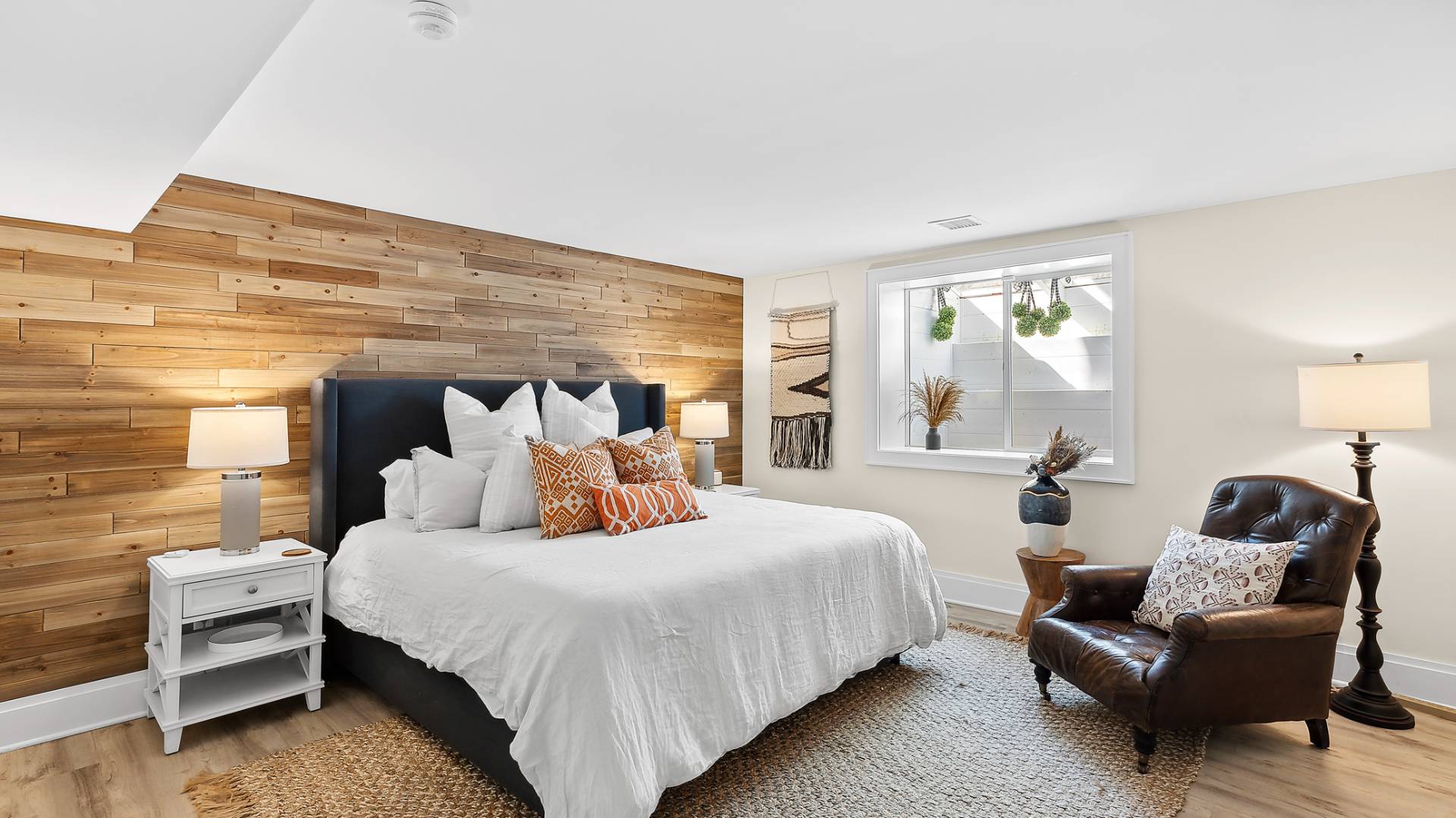 4 Arthur Avenue Bridgehampton, NY 11932 - Photo 10 of 13 a bedroom with a bed and a couch
