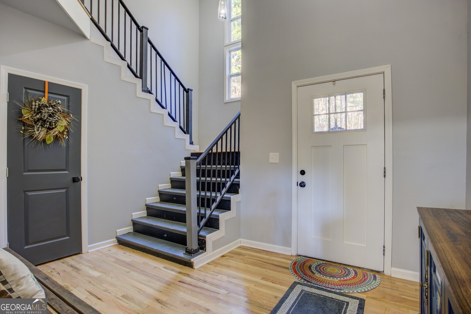 13 Goldfinch Circle Monticello, GA 31064 - Photo 11 of 44 a view of entryway with wooden floor and stairs