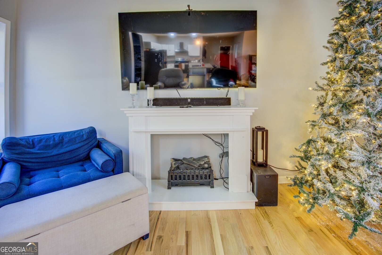 13 Goldfinch Circle Monticello, GA 31064 - Photo 18 of 44 a living room with a couch and a fireplace with wooden floor