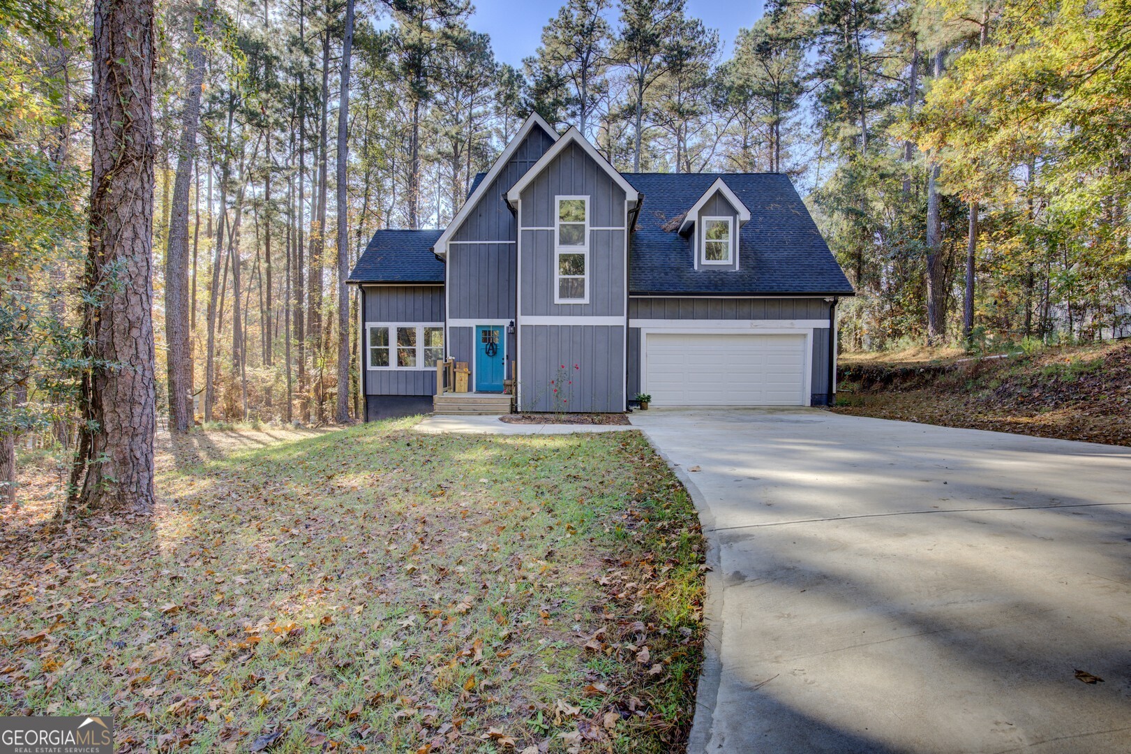 13 Goldfinch Circle Monticello, GA 31064 - Photo 2 of 44 a front view of a house with a yard and garage