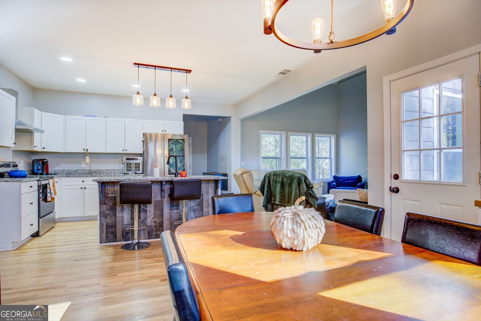 13 Goldfinch Circle Monticello, GA 31064 - Photo 21 of 44 a kitchen with kitchen island a dining table and chairs