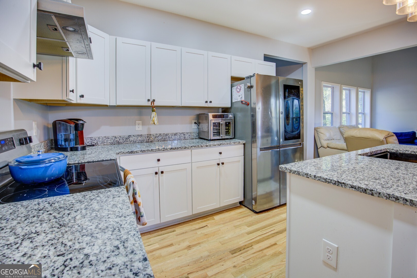 13 Goldfinch Circle Monticello, GA 31064 - Photo 24 of 44 a kitchen with stainless steel appliances granite countertop a sink refrigerator and cabinets