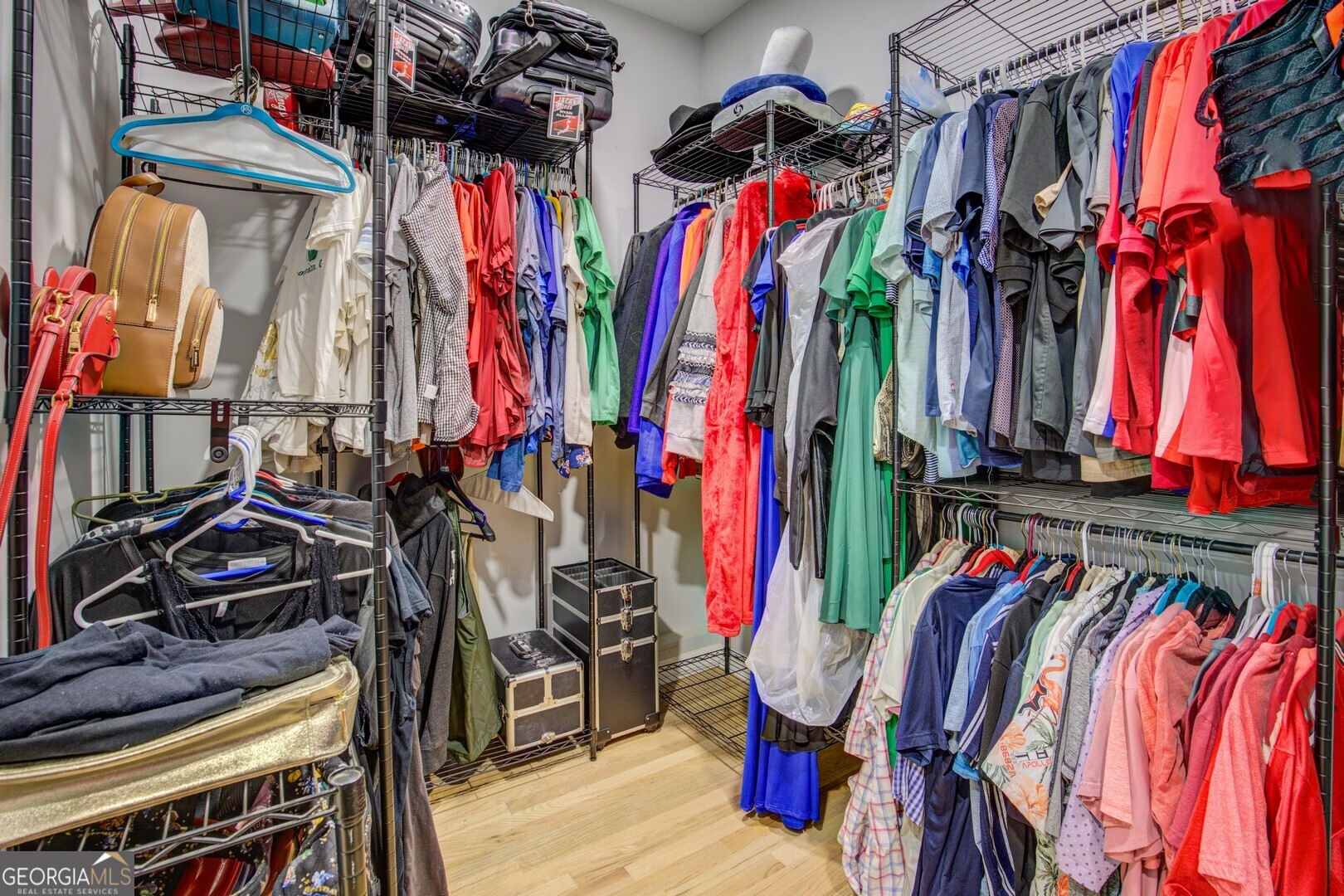13 Goldfinch Circle Monticello, GA 31064 - Photo 33 of 44 a view of walk in closet with clothes
