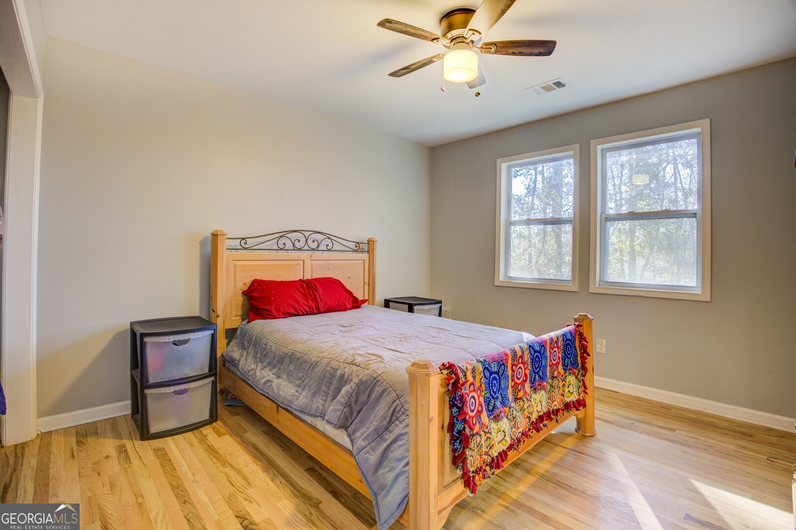 13 Goldfinch Circle Monticello, GA 31064 - Photo 39 of 44 a bedroom with a bed and a chandelier