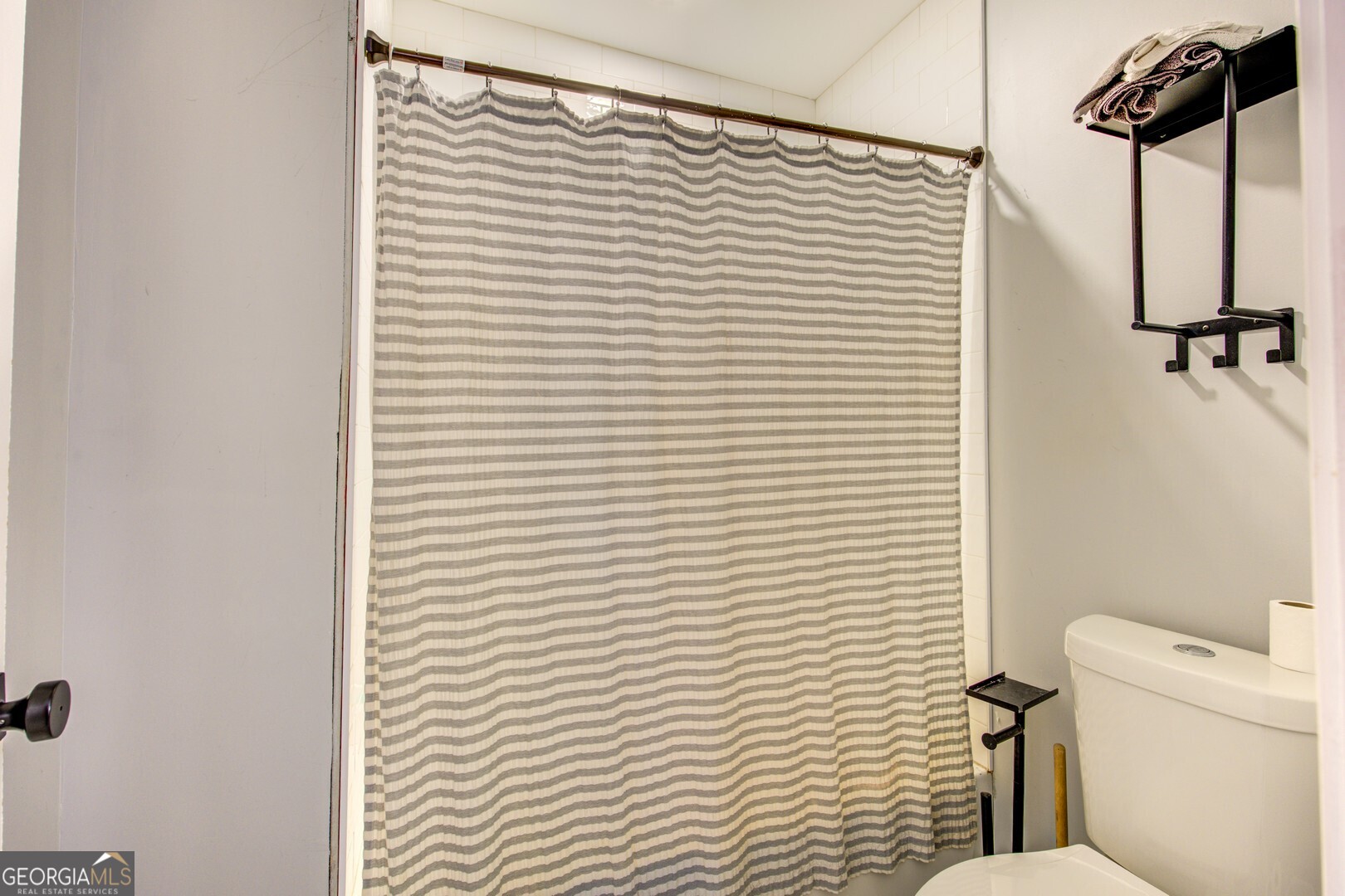 13 Goldfinch Circle Monticello, GA 31064 - Photo 42 of 44 a bathroom with a toilet and a shower