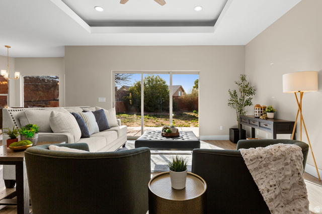 1570 South Rio Virgin Drive Washington, UT 84780 - Photo 13 of 71 Living room featuring wood finished floors, a ceiling fan, a raised ceiling, and hanging lights