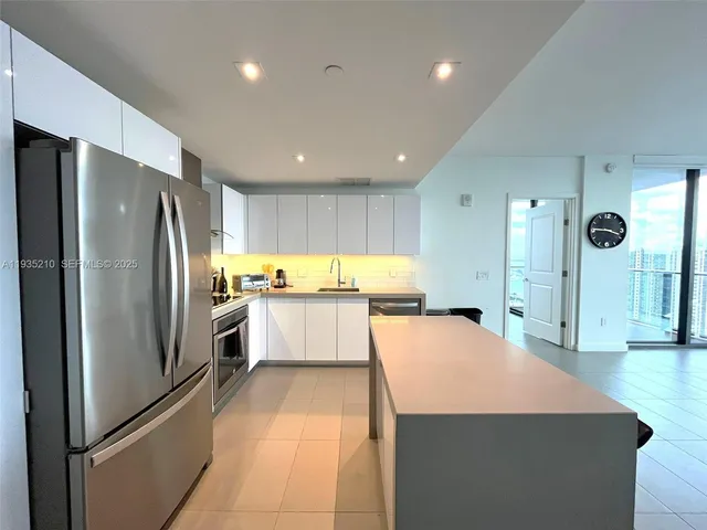 a view of a livingroom with a kitchen