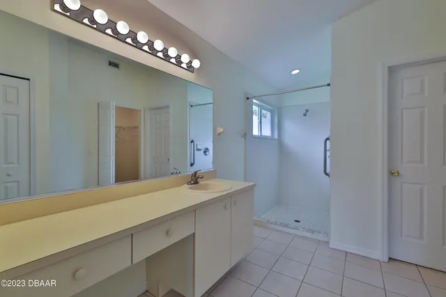 a bathroom with a sink and shower