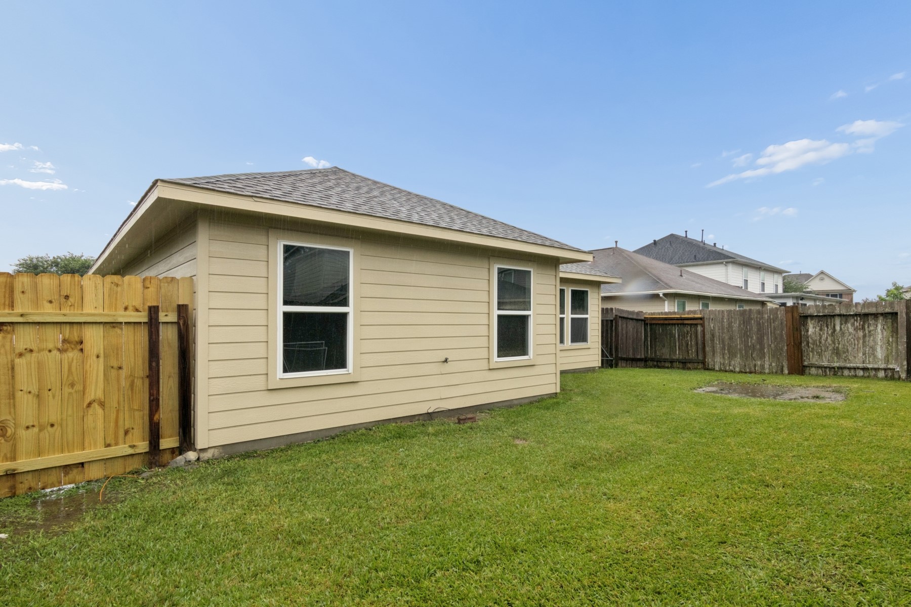 7811 Adonis Avenue Baytown, TX 77521 - Photo 34 of 36 a front view of a house with a garden