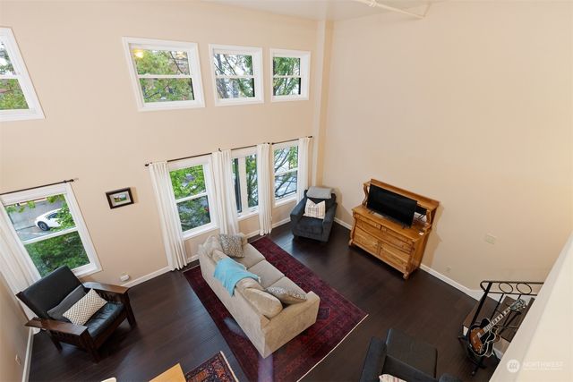 a bedroom with a bed and a refrigerator