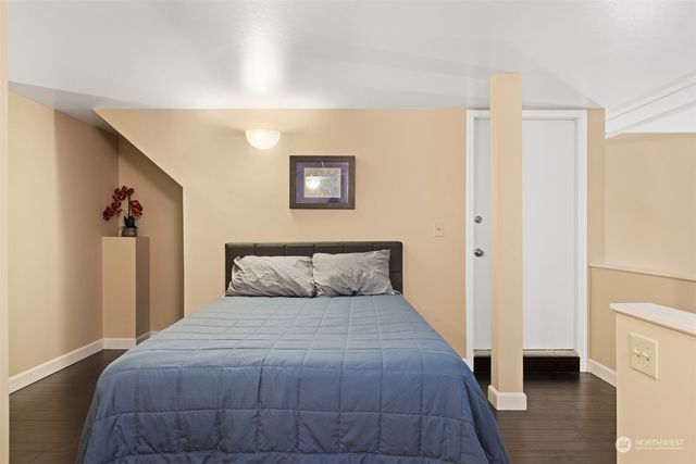 a bedroom with a bed and a view of bathroom