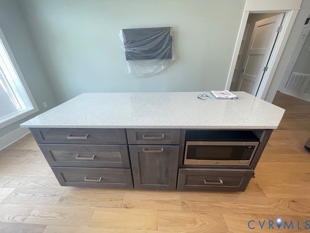 45 Cross Street, Unit B Urbanna, VA 23175 - Photo 13 of 25 a room with a bed and a mirror