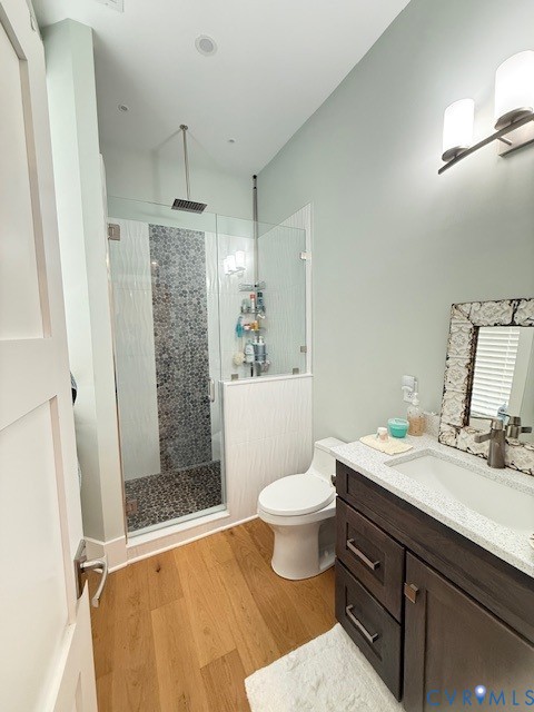 45 Cross Street, Unit B Urbanna, VA 23175 - Photo 20 of 25 a bathroom with a sink toilet a mirror and shower