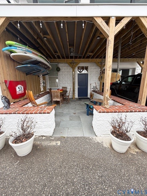 45 Cross Street, Unit B Urbanna, VA 23175 - Photo 3 of 25 a view of a chairs and table in a patio