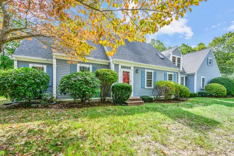 front view of a house with a yard