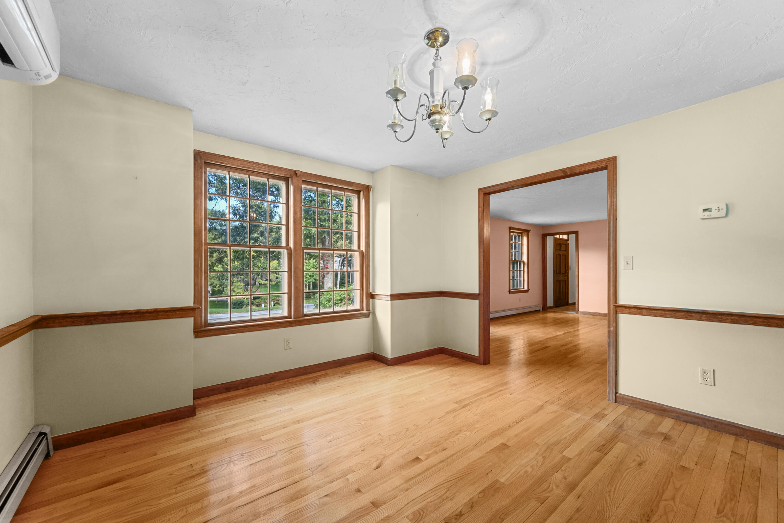 9 Crestview Dr Extension Sandwich, MA 02537 - Photo 13 of 45 a view of an empty room with wooden floor and a window