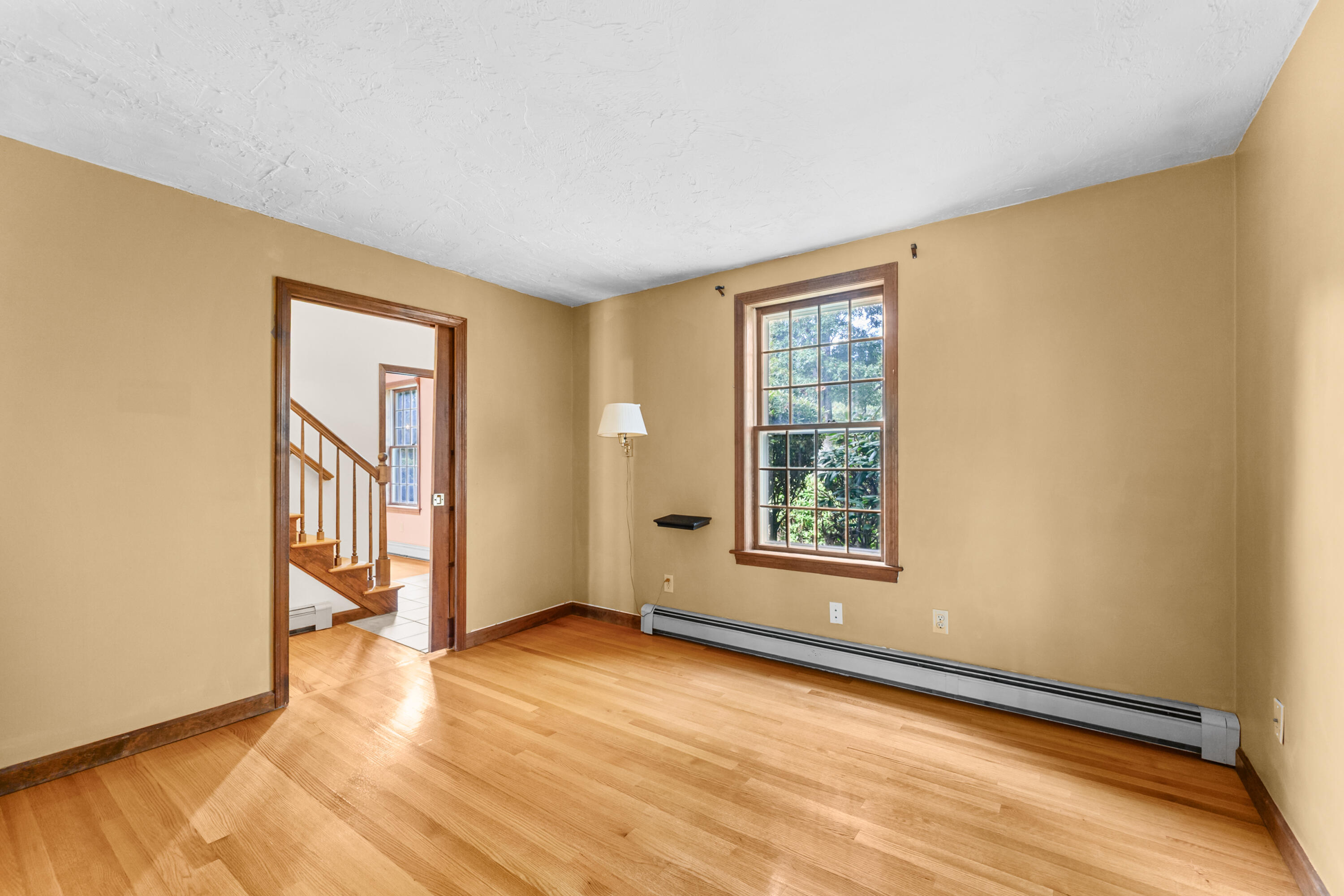 9 Crestview Dr Extension Sandwich, MA 02537 - Photo 21 of 45 a view of an empty room with a window and wooden floor