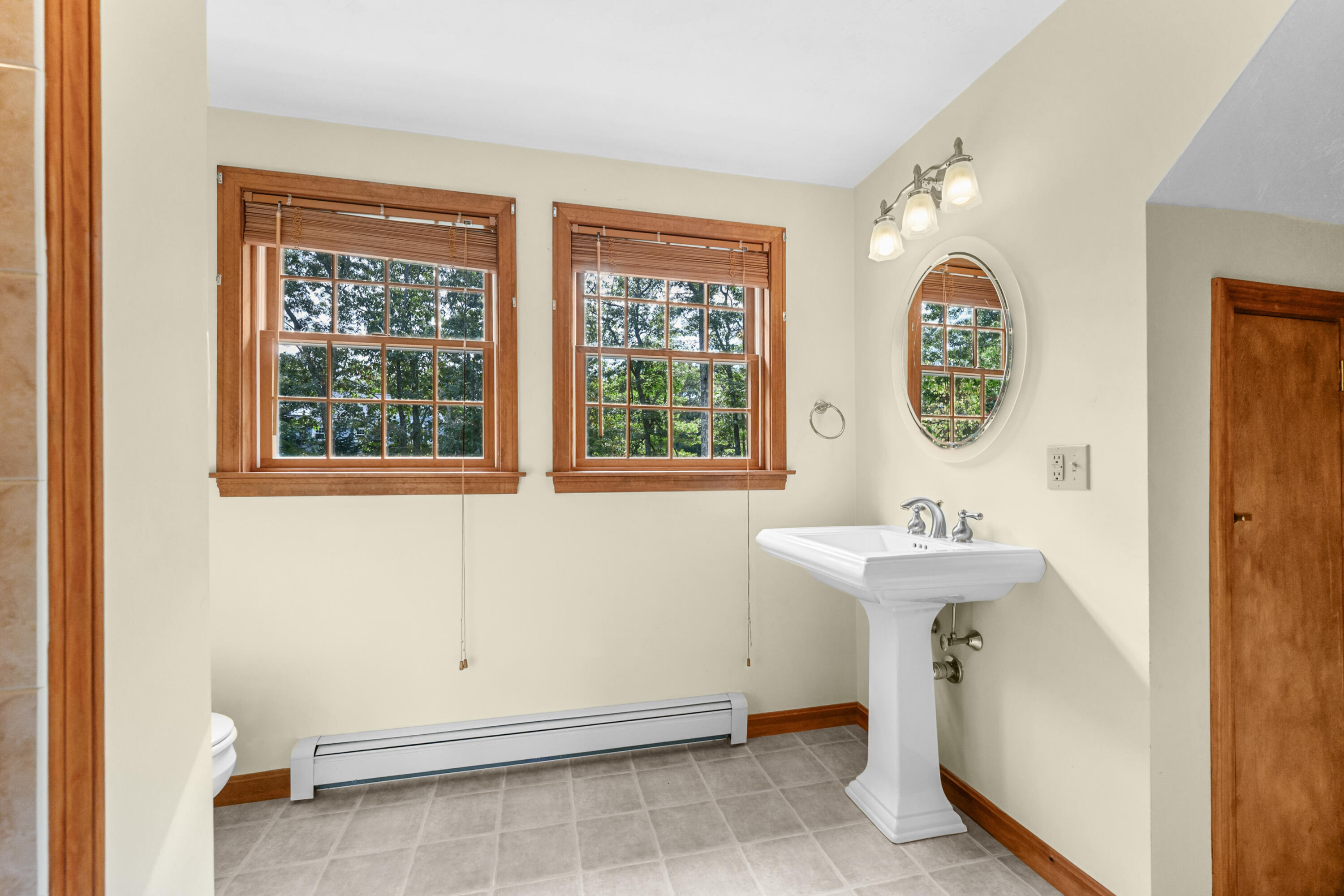 9 Crestview Dr Extension Sandwich, MA 02537 - Photo 30 of 45 a view of a bathroom with 2 sink window and a mirror