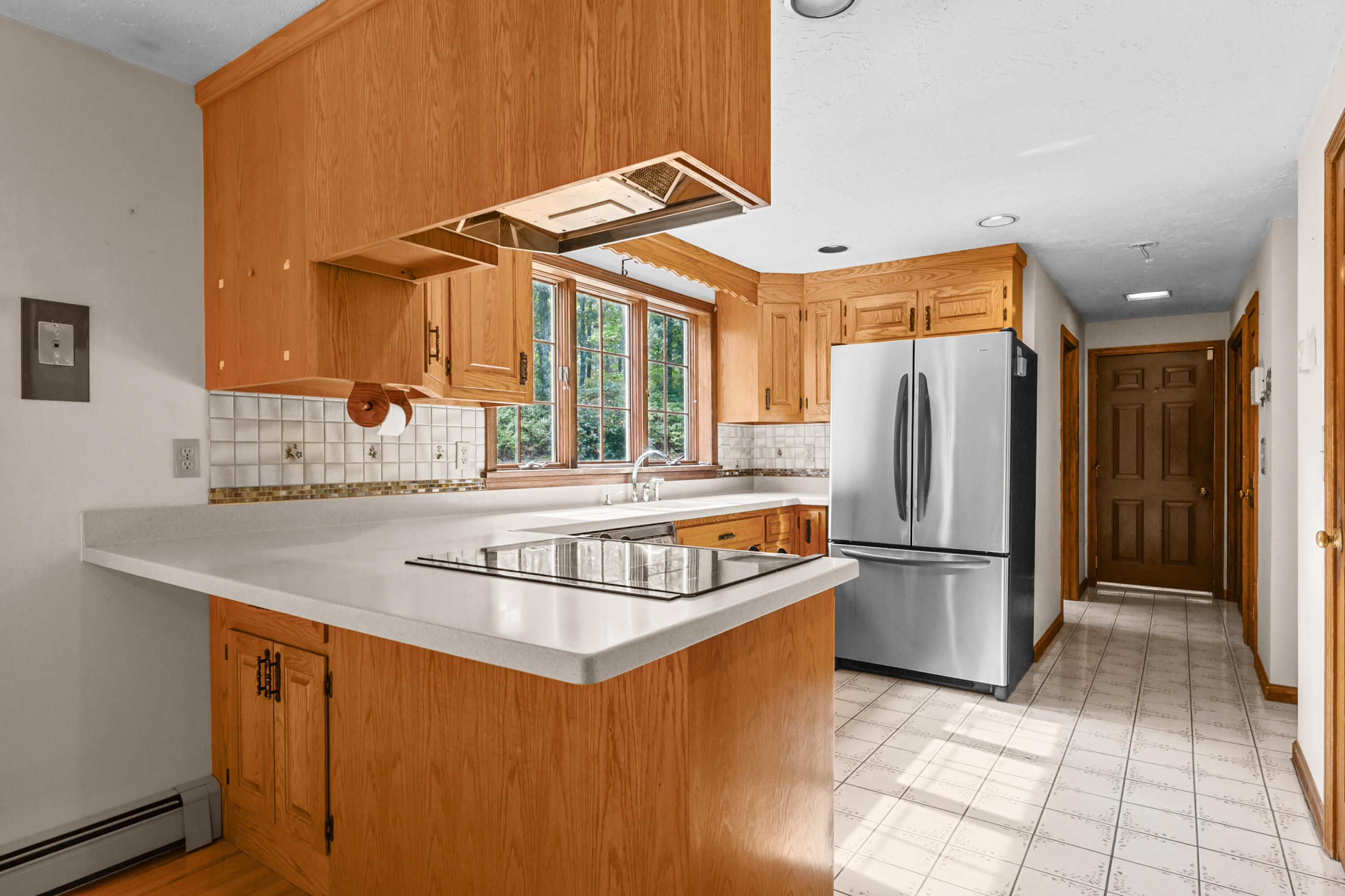 9 Crestview Dr Extension Sandwich, MA 02537 - Photo 8 of 45 a kitchen with refrigerator and cabinets