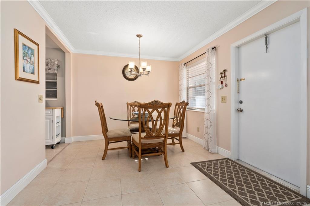2600 Southeast Ocean Boulevard, Unit EE12 Stuart, FL 34996 - Photo 11 of 43 a dining room with furniture and window