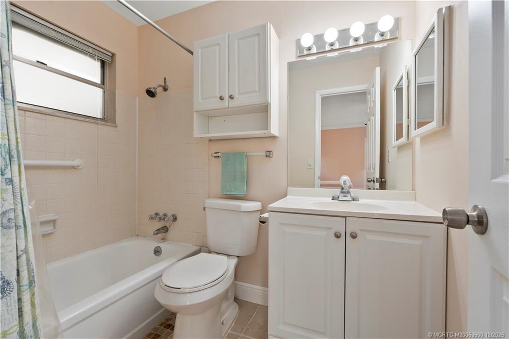 2600 Southeast Ocean Boulevard, Unit EE12 Stuart, FL 34996 - Photo 16 of 43 a bathroom with a sink a toilet and shower