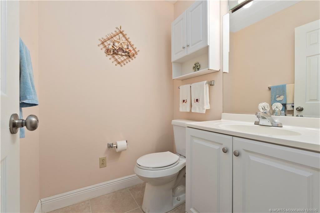2600 Southeast Ocean Boulevard, Unit EE12 Stuart, FL 34996 - Photo 19 of 43 a bathroom with a toilet sink and mirror