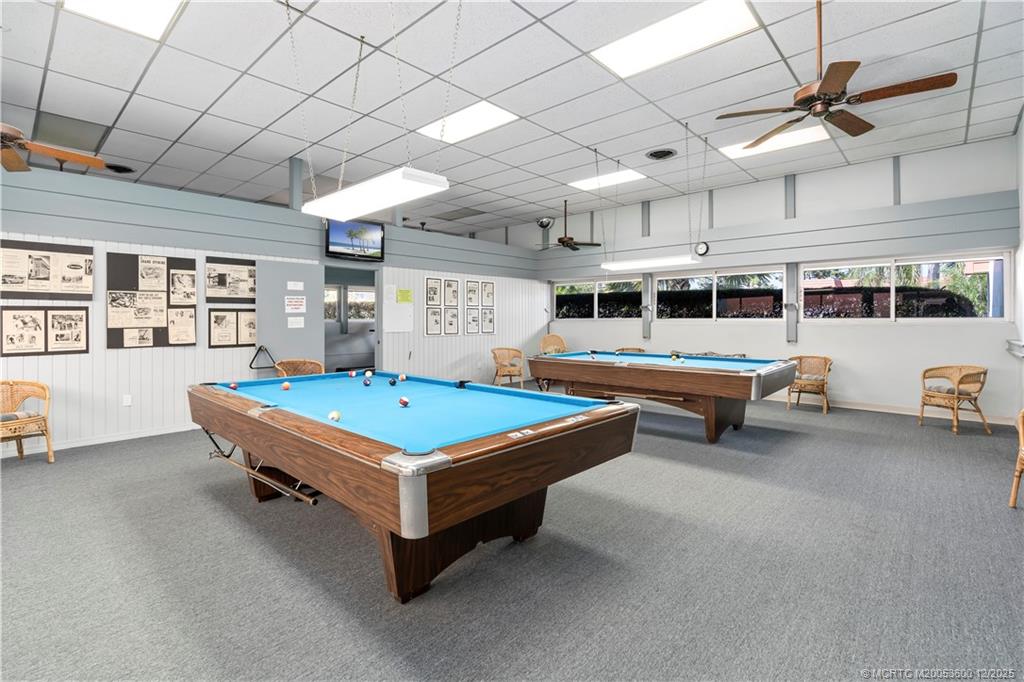 2600 Southeast Ocean Boulevard, Unit EE12 Stuart, FL 34996 - Photo 33 of 43 a living room with furniture pool table and flat screen tv