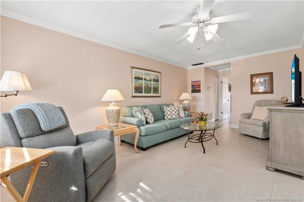2600 Southeast Ocean Boulevard, Unit EE12 Stuart, FL 34996 - Photo 4 of 43 a living room with furniture and a large window