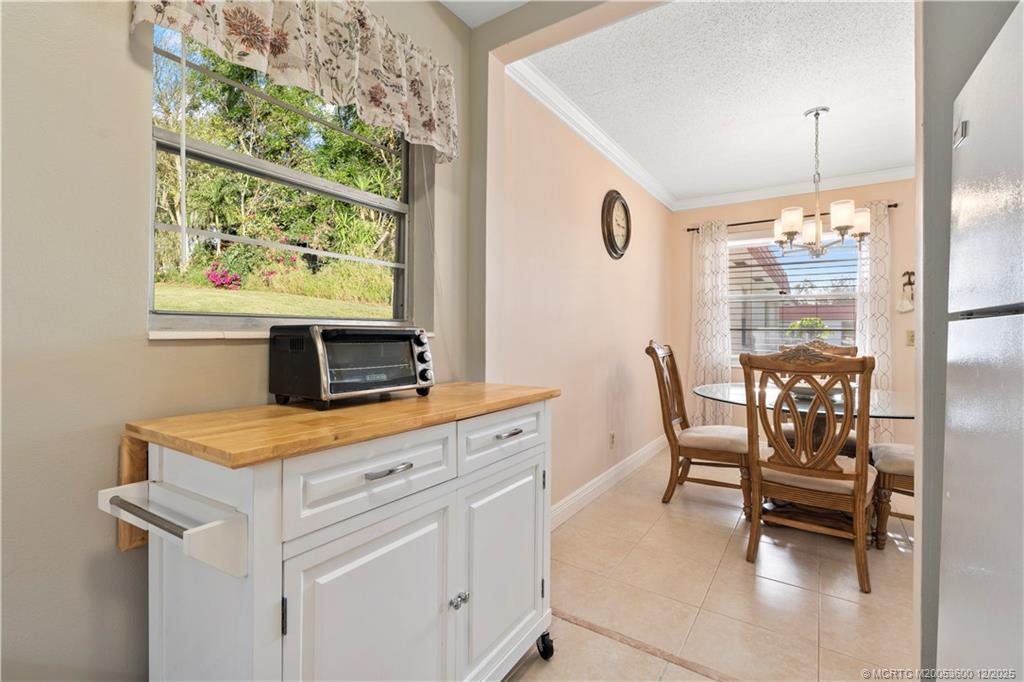 2600 Southeast Ocean Boulevard, Unit EE12 Stuart, FL 34996 - Photo 9 of 43 a view of kitchen with furniture and window